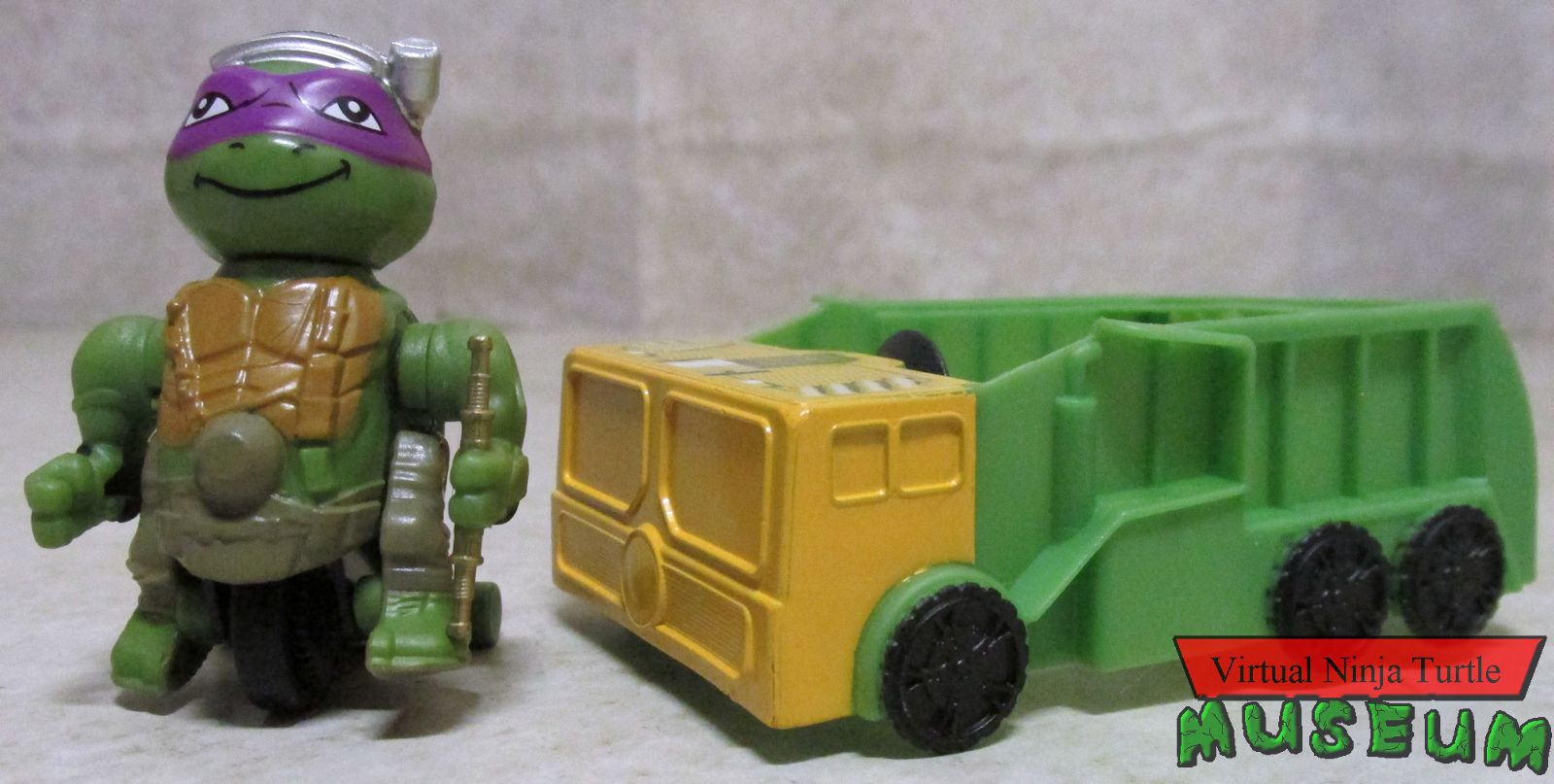 Out of the Shadows T-Sprints Donatello with trash truck