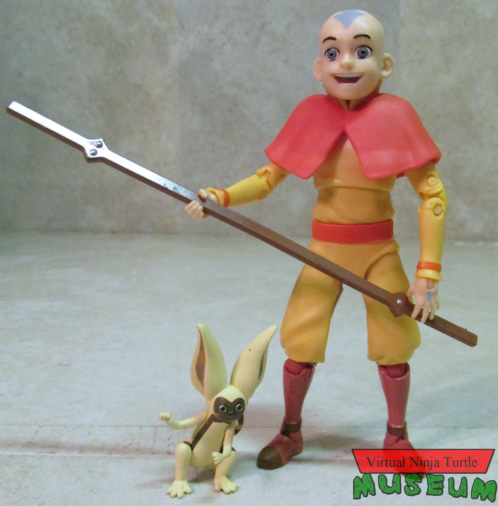 Aang with staff and Momo
