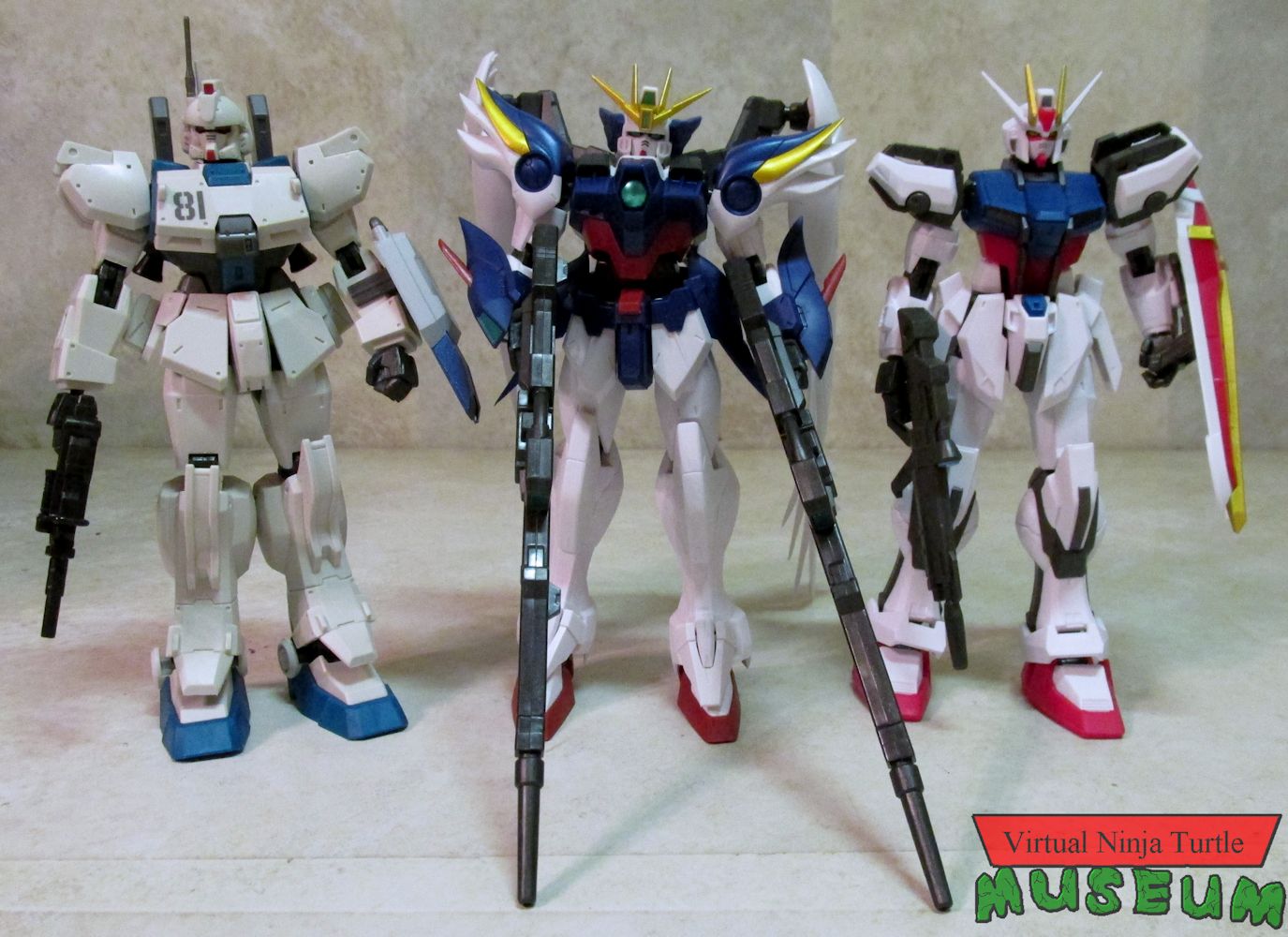 Wave three: Strike Gundam, Wing Zero and Gundam EZ