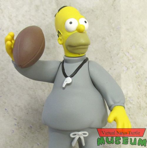 coach Homer posed with football